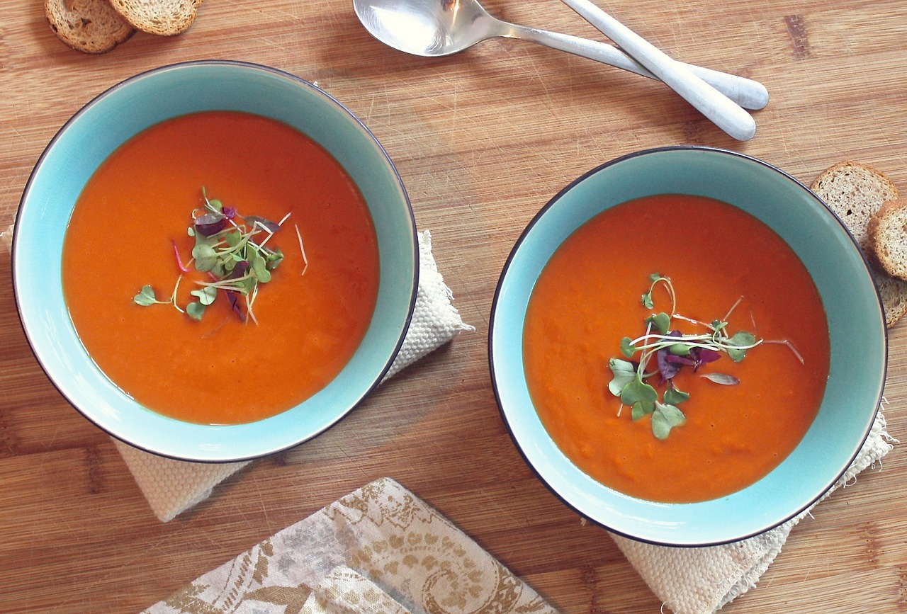 Tomato soup in two bowls on a table.