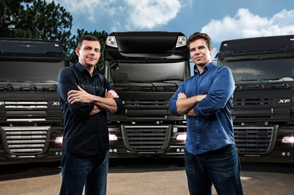 CargoX Founders Standing in Front of Trucks